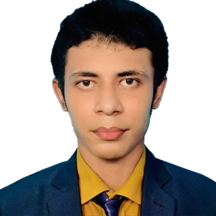 Taiyob Ali, founder of Pinevon, in a navy suit, mustard shirt and tie